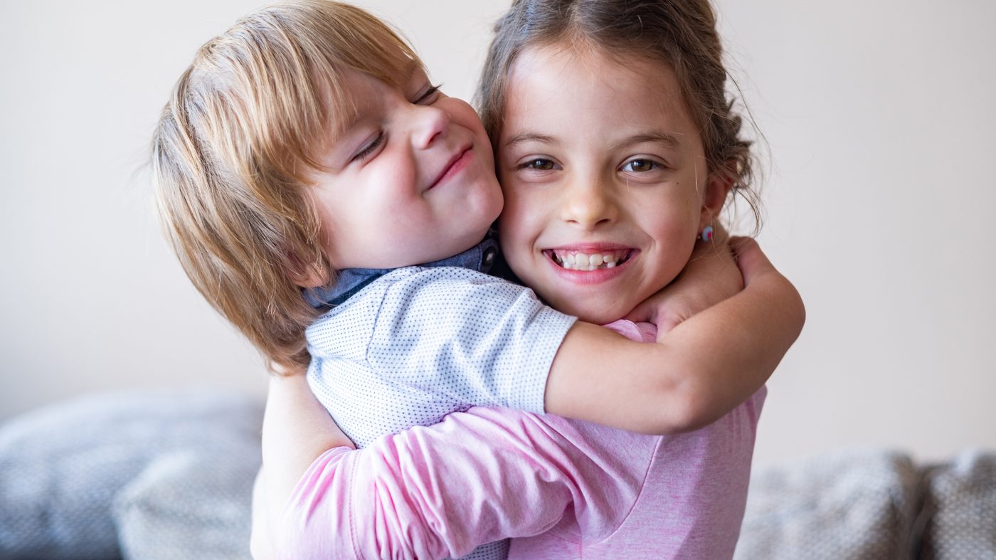 Two kids hugging